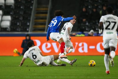 091225 - Swansea City v Portsmouth - Sky Bet Championship - Marko Stamenic of Swansea City tackles Harvey Blair of Portsmouth