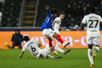 091225 - Swansea City v Portsmouth - Sky Bet Championship - Marko Stamenic of Swansea City tackles Harvey Blair of Portsmouth