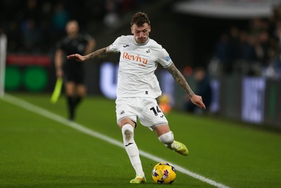 091225 - Swansea City v Portsmouth - Sky Bet Championship - Josh Tymon of Swansea City crosses the ball