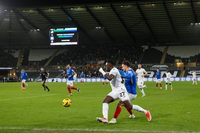 091225 - Swansea City v Portsmouth - Sky Bet Championship - Zeidane Inoussa of Swansea City and Jordan Williams of Portsmouth compete for the ball