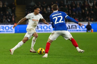 091225 - Swansea City v Portsmouth - Sky Bet Championship - Ronald Pereira Martin of Swansea City takes on Zak Swanson of Portsmouth