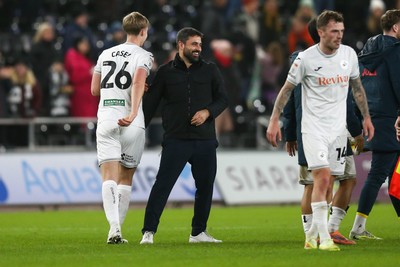 091225 - Swansea City v Portsmouth - Sky Bet Championship - Swansea City manager Vitor Matos celebrates with Kaelan Casey after the final whistle