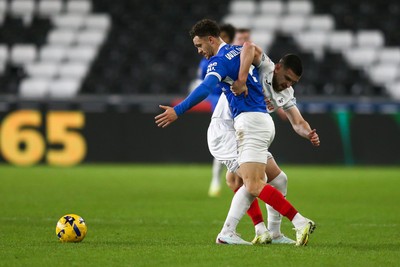 091225 - Swansea City v Portsmouth - Sky Bet Championship - Zan Vipotnik of Swansea City and Jordan Williams of Portsmouth compete for the ball