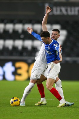 091225 - Swansea City v Portsmouth - Sky Bet Championship - Zan Vipotnik of Swansea City and Jordan Williams of Portsmouth compete for the ball