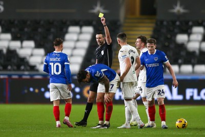091225 - Swansea City v Portsmouth - Sky Bet Championship - Referee Tom Reeves shows Marlon Pack of Portsmouth a yellow card