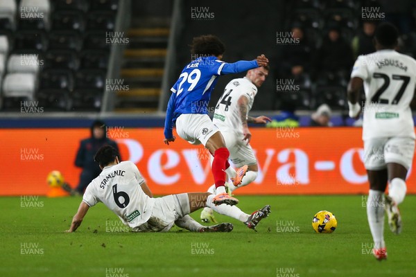 091225 - Swansea City v Portsmouth - Sky Bet Championship - Marko Stamenic of Swansea City tackles Harvey Blair of Portsmouth