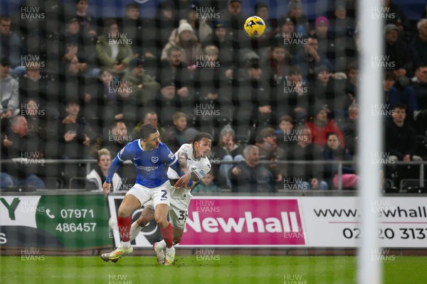 091225 - Swansea City v Portsmouth - Sky Bet Championship - Ronald Pereira Martin of Swansea City and Jordan Williams of Portsmouth compete for the ball