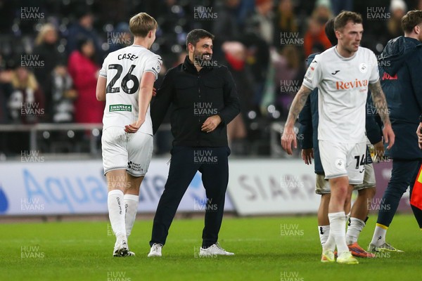 091225 - Swansea City v Portsmouth - Sky Bet Championship - Swansea City manager Vitor Matos celebrates with Kaelan Casey after the final whistle
