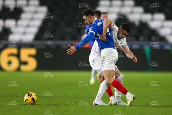 091225 - Swansea City v Portsmouth - Sky Bet Championship - Zan Vipotnik of Swansea City and Jordan Williams of Portsmouth compete for the ball