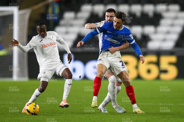 091225 - Swansea City v Portsmouth - Sky Bet Championship - Zan Vipotnik of Swansea City and Jordan Williams of Portsmouth compete for the ball as Malick Yalcouyé of Swansea City (L) moves in