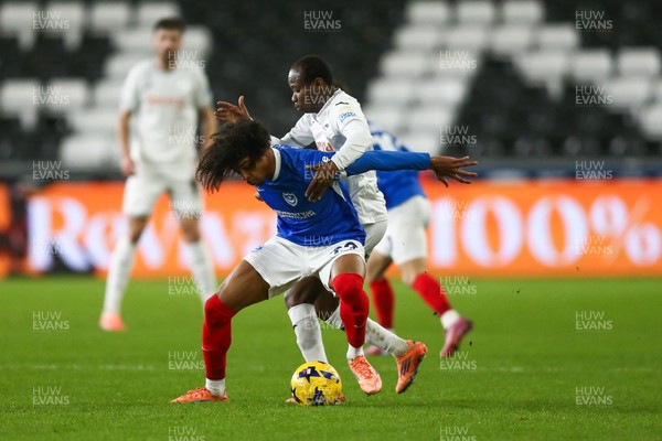 091225 - Swansea City v Portsmouth - Sky Bet Championship - Harvey Blair of Portsmouth and Malick Yalcouyé of Swansea City compete for the ball