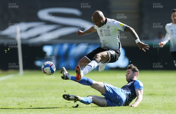 050421 Swansea City v Preston North End, Sky Bet Championship - Andre Ayew of Swansea City is tackled by Andrew Hughes of Preston North End