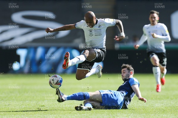 050421 Swansea City v Preston North End, Sky Bet Championship - Andre Ayew of Swansea City is tackled by Andrew Hughes of Preston North End
