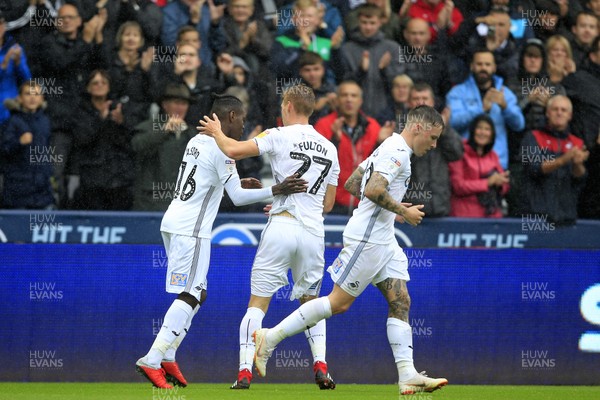 110818 - Swansea City v Preston North End, EFL Championship - Jay Fulton of Swansea City (centre) celebrates scoring his side's first goal with team-mates