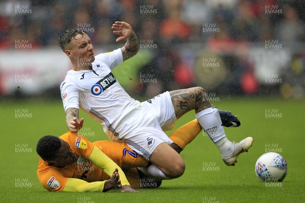 110818 - Swansea City v Preston North End, EFL Championship - Barrie McKay of Swansea City (right) is brought down by Darnell Fisher of Preston North End