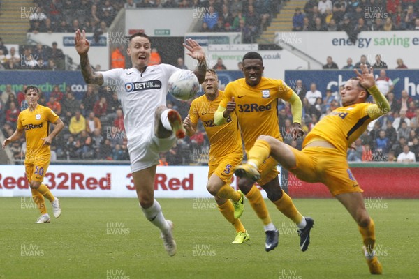 110818 - Swansea City v Preston North End, EFL Championship - Barrie McKay of Swansea City (left) and Alan Browne of Preston North End (right) battle for the ball