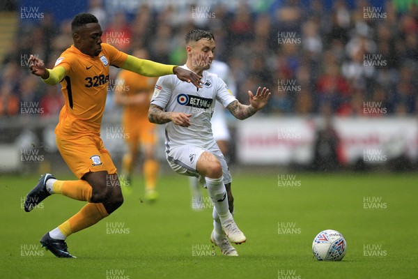 110818 - Swansea City v Preston North End, EFL Championship - Barrie McKay of Swansea City (right) in action with Darnell Fisher of Preston North End