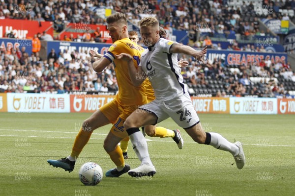 170819 - Swansea City v Preston North End, Sky Bet Championship - Jake Bidwell of Swansea City (right) and Paul Gallagher of Preston North End battle for the ball
