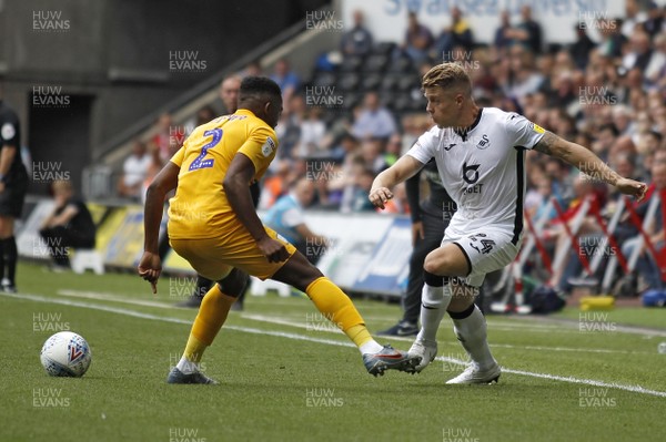 170819 - Swansea City v Preston North End, Sky Bet Championship - Jake Bidwell of Swansea City (right) in action with Darnell Fisher of Preston North End