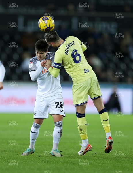 221223 - Swansea City v Preston North End - SkyBet Championship - Liam Walsh of Swansea City is challenged by Alan Browne of Preston North End 