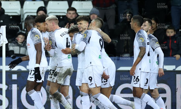 221223 - Swansea City v Preston North End - SkyBet Championship - Jamie Paterson of Swansea City celebrates scoring a goal with team mates
