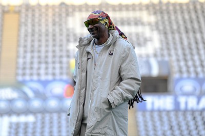 240226 - Swansea City v Preston North End - Sky Bet Championship - Picture shows Swansea City Majority Shareholder Snoop Dogg on his visit to the SwanseaCom Stadium being taken on a tour of the pitch