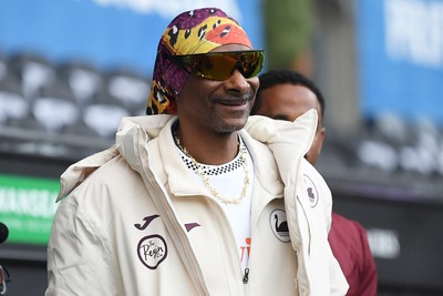 240226 - Swansea City v Preston North End - Sky Bet Championship - Picture shows Swansea City Majority Shareholder Snoop Dogg on his visit to the SwanseaCom Stadium being taken on a tour of the pitch