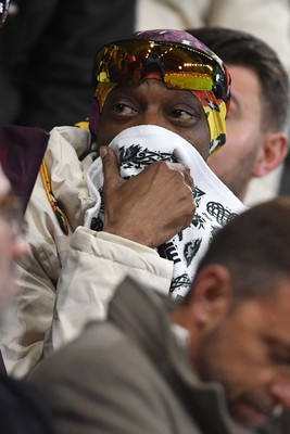 240226 - Swansea City v Preston North End - Sky Bet Championship - Snoop Dogg watches the game while covering his face after Preston score the opening goal