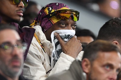 240226 - Swansea City v Preston North End - Sky Bet Championship - Snoop Dogg watches the game while covering his face after Preston score the opening goal