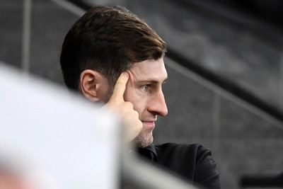 240226 - Swansea City v Preston North End - Sky Bet Championship - Wales Captain Ben Davies watches the game
