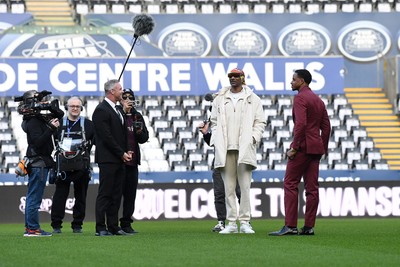 240226 - Swansea City v Preston North End - Sky Bet Championship - Picture shows Lee Trundle (Left) and Swansea City Majority Shareholder Snoop Dogg on his visit to the SwanseaCom Stadium being taken on a tour of the pitch