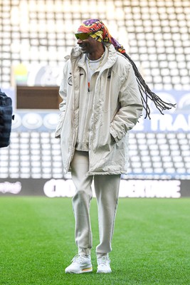 240226 - Swansea City v Preston North End - Sky Bet Championship - Picture shows Swansea City Majority Shareholder Snoop Dogg on his visit to the SwanseaCom Stadium being taken on a tour of the pitch