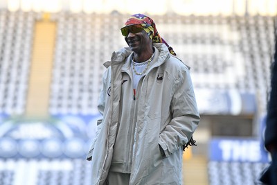240226 - Swansea City v Preston North End - Sky Bet Championship - Picture shows Swansea City Majority Shareholder Snoop Dogg on his visit to the SwanseaCom Stadium being taken on a tour of the pitch