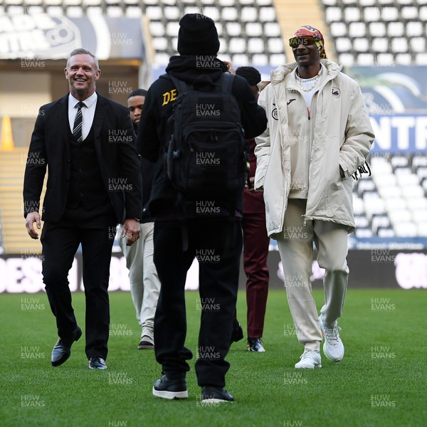 240226 - Swansea City v Preston North End - Sky Bet Championship - Picture shows Lee Trundle (Left) and Swansea City Majority Shareholder Snoop Dogg on his visit to the SwanseaCom Stadium being taken on a tour of the pitch