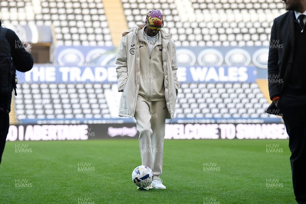 240226 - Swansea City v Preston North End - Sky Bet Championship - Picture shows Swansea City Majority Shareholder Snoop Dogg on his visit to the SwanseaCom Stadium being taken on a tour of the pitch
