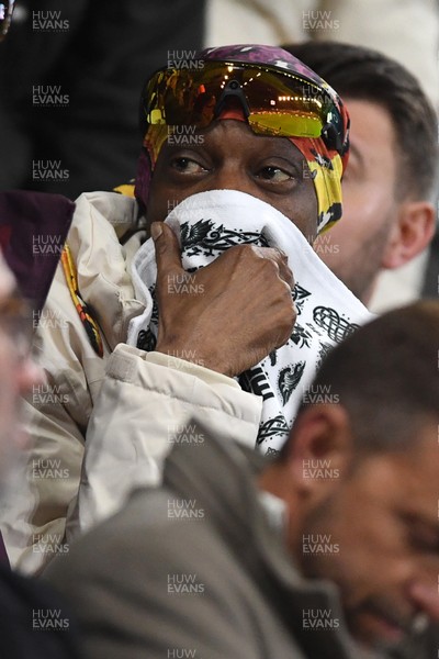 240226 - Swansea City v Preston North End - Sky Bet Championship - Snoop Dogg watches the game while covering his face after Preston score the opening goal