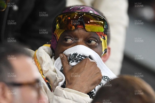 240226 - Swansea City v Preston North End - Sky Bet Championship - Snoop Dogg watches the game while covering his face after Preston score the opening goal