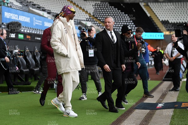 240226 - Swansea City v Preston North End - Sky Bet Championship - Picture shows Lee Trundle (Right) and Swansea City Majority Shareholder Snoop Dogg on his visit to the SwanseaCom Stadium being taken on a tour of the pitch