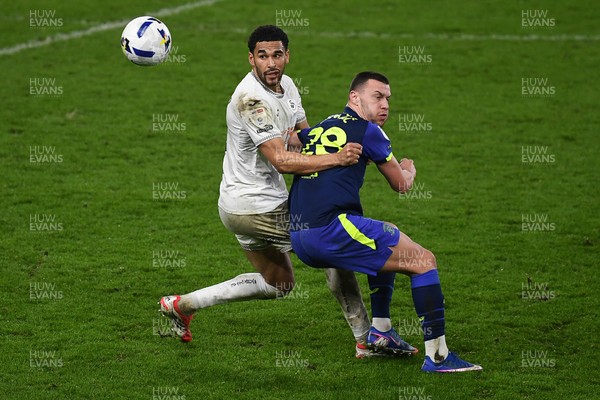 240226 - Swansea City v Preston North End - Sky Bet Championship - Ben Cabango of Swansea City is challenged by Milutin Osmajic