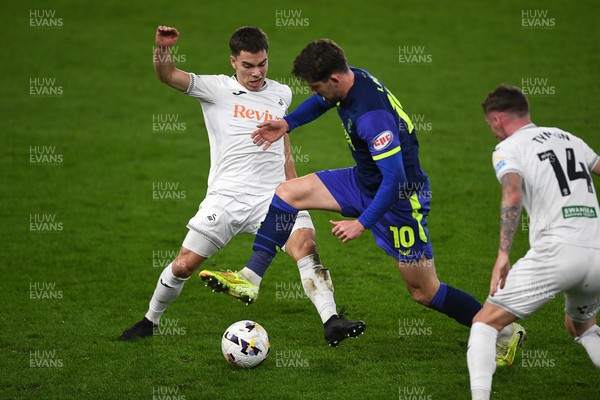 240226 - Swansea City v Preston North End - Sky Bet Championship - Leo Walta of Swansea City is challenged by Callum Lang of Preston