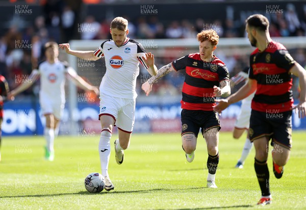010424 - Swansea City v Queens Park Rangers - SkyBet Championship - Harry Darling of Swansea is challenged by Jack Colback of QPR 