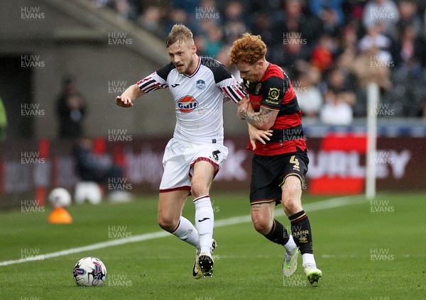 010424 - Swansea City v Queens Park Rangers - SkyBet Championship - Harry Darling of Swansea is challenged by Jack Colback of QPR 