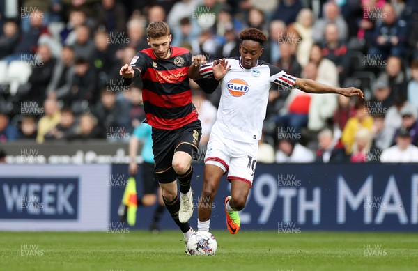 010424 - Swansea City v Queens Park Rangers - SkyBet Championship - Sam Field of QPR is tackled by Jamal Lowe of Swansea 