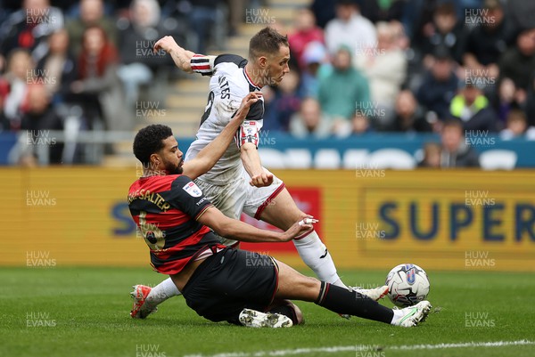 010424 - Swansea City v Queens Park Rangers - SkyBet Championship - Jerry Yates of Swansea is tackled by Jake Clarke-Salter of QPR 