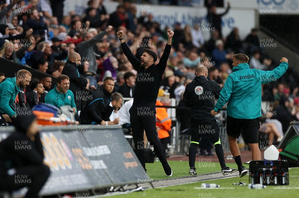 030922 - Swansea City v Queens Park Rangers - SkyBet Championship - Swansea City Manager Russell Martin celebrates the victory in the dug outs on the final whistle