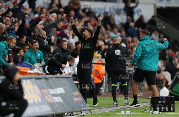 030922 - Swansea City v Queens Park Rangers - SkyBet Championship - Swansea City Manager Russell Martin celebrates the victory in the dug outs on the final whistle