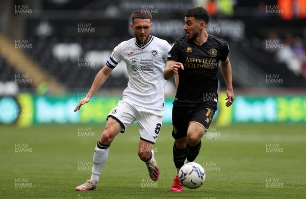 070522 - Swansea City v Queens Park Rangers - SkyBet Championship - Ilias Chair of QPR is challenged by Matt Grimes of Swansea City