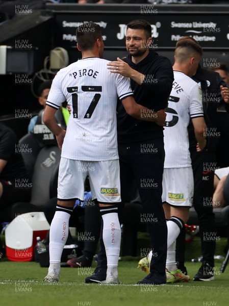 070522 - Swansea City v Queens Park Rangers - SkyBet Championship - Joel Piroe of Swansea City hugs Swansea City Manager Russell Martin as he is subbed 