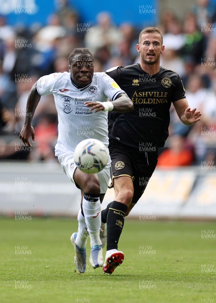 070522 - Swansea City v Queens Park Rangers - SkyBet Championship - Michael Obafemi of Swansea City is challenged by Dominic Ball of QPR
