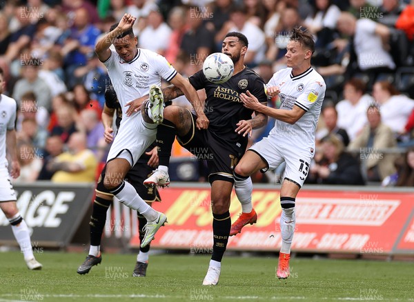 070522 - Swansea City v Queens Park Rangers - SkyBet Championship - Andre Gray of QPR is challenged by Korey Smith and Hannes Wolf of Swansea City